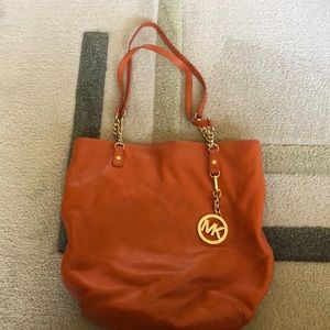 orange Michael Kors over the shoulder bag. Great shape, only a little worn in.